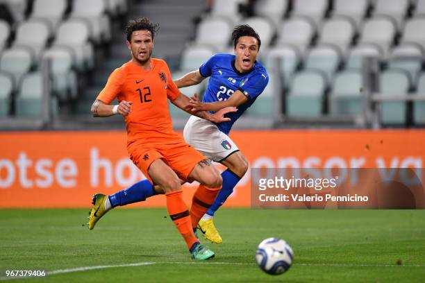 Federico Chiesa of Italy competes for the ball with Daryl Janmaat of Netherlands during the International Friendly match between Italy and...