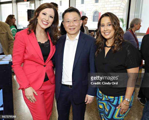 Sing For Hope co-founders Camille Zamora and Monica Yunus pose for a photo with Wei Bo of Fosun Property Holdings as the 2018 Sing for Hope Pianos...