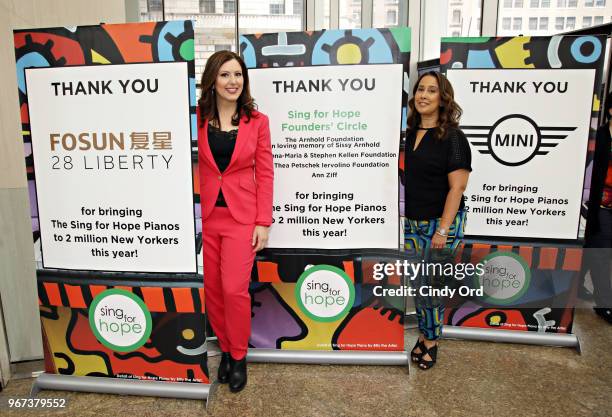 Sing For Hope co-founders Monica Yunus and Camille Zamora pose for a photo as the 2018 Sing for Hope Pianos are unveiled at 28 Liberty on June 4,...