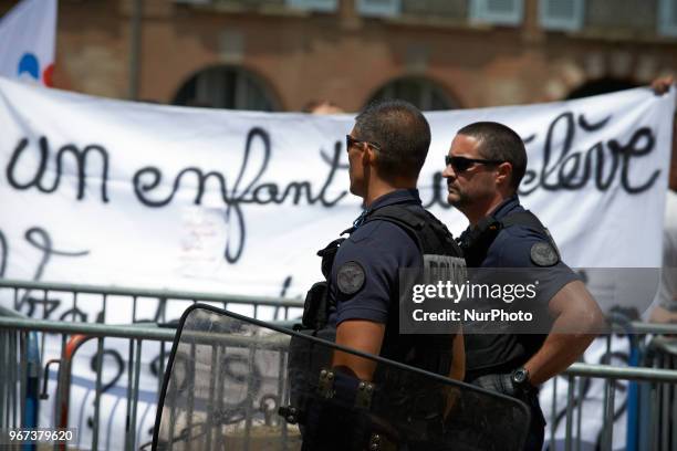 Riotpolicemen in front of a banner reading 'One pupil'. Primary school teachers and parents'pupils gathered and demonstrated in front of the...