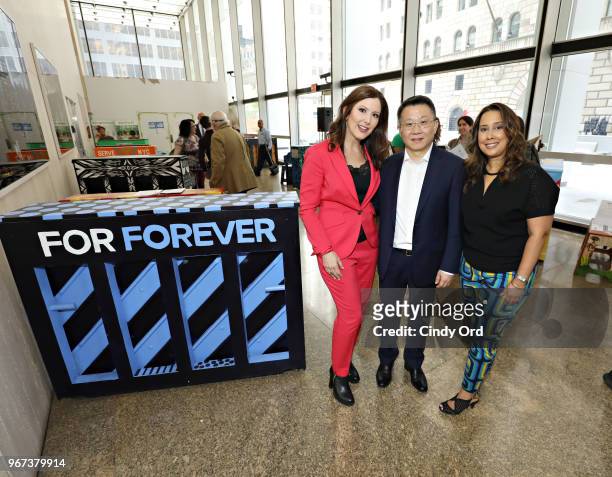 Sing For Hope co-founders Camille Zamora and Monica Yunus pose for a photo with Wei Bo of Fosun Property Holdings as the 2018 Sing for Hope Pianos...