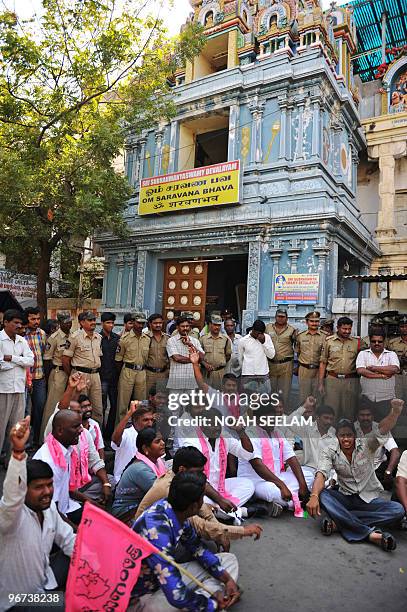 Indian police guard at the famous Subramanya Swamy Hindu Temple as members of the Telangana Rashtra Samithi party hold a protest in Secunderabad on...