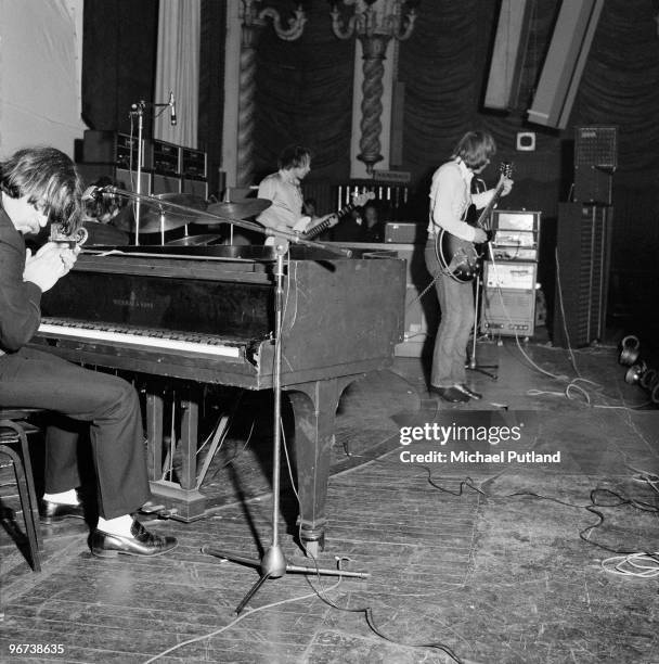 English pop group Procul Harum performing at the Lyceum Theatre, London in May 1970, with Gary Brooker at the piano and Robin Trower on guitar .