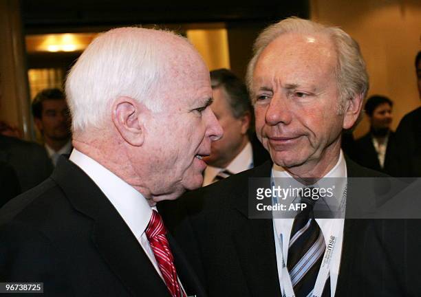 Senator John McCain and US Senator Joseph Lieberman chat during the second day of the 46th Munich Security Conference, at the Bayerischer Hof hotel...