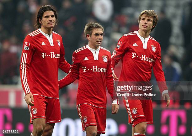 Mario Gomez; Philipp Lahm and Holger Badstuber of Bayern are seen after the Bundesliga match between FC Bayern Muenchen and Borussia Dortmund at...