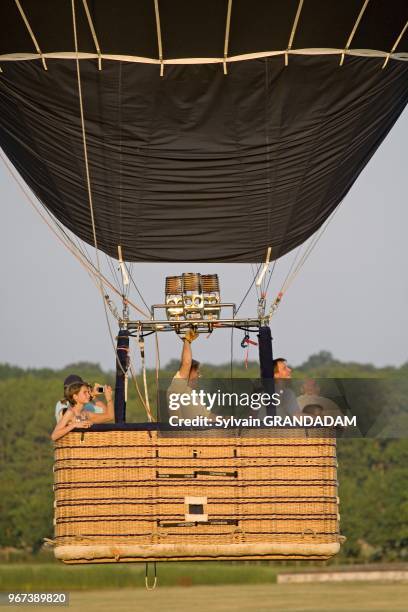 Hot-air balloon taking off. Chambord castle and 5440 ha game national preserve. The castle, largest in Touraine, was built in 1519-1547 by king...