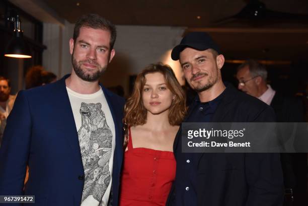 Simon Evans, Sophie Cookson and Orlando Bloom attend the press night after party for "Killer Joe" at Leicester Square Kitchen on June 4, 2018 in...