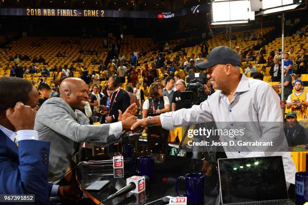 Kenny Smith exchanges handshakes with Reggie Jackson prior to Game Two of the 2018 NBA Finals between the Golden State Warriors and Cleveland...