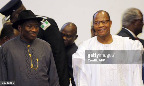 Nigerian Acting President Goodluck Jonathan and President of the Economic Community of West African States Commission Mohamed Ibn Chambas stand for...