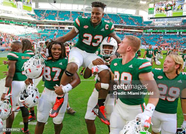 Miami Hurricanes tight end Christopher Herndon IV is carried off by teammates after the University of Miami Hurricanes defeated the Virginia...
