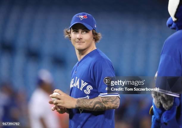 Olympic gold medal winning snowboarder Sebastien Toutant gets ready to throw out the first pitch before the start of the Toronto Blue Jays MLB game...