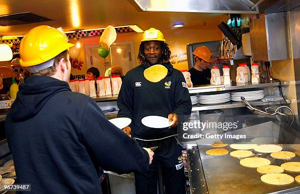 Joe Simpson and Paul Sackey of London Wasps flip pancakes during a photo call to promote the ChildLine & Guinness Premiership Kicking Bullying into...