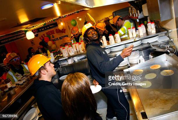 Joe Simpson and Paul Sackey of London Wasps flip pancakes during a photo call to promote the ChildLine & Guinness Premiership Kicking Bullying into...