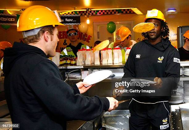 Joe Simpson and Paul Sackey of London Wasps flip pancakes during a photo call to promote the ChildLine & Guinness Premiership Kicking Bullying into...