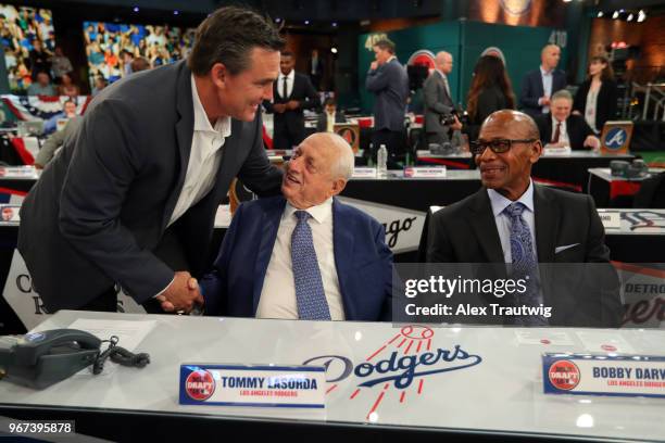 Tim Salmon shakes hands with Hall of Famer Tommy Lasorda prior to the 2018 Major League Baseball Draft at Studio 42 at the MLB Network on Monday,...