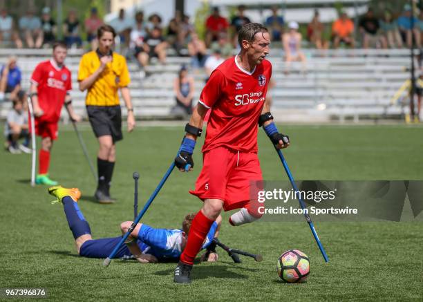 Team England Ray Westbrook wins the ball from Team USA Noahh Grove during the Lone Star Invitational Amputee Soccer tournament on June 2, 2018 at...