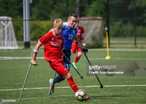 Team England Jamie Tregaskiss and Team USA Nico Calabria fight for ball during the Lone Star Invitational Amputee Soccer tournament on June 2, 2018...
