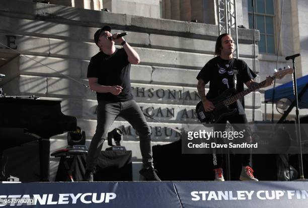 Singer Patrick Stump and guitarist Pete Wentz of Fall Out Boy performs before Game Four of the 2018 NHL Stanley Cup Final between the Vegas Golden...