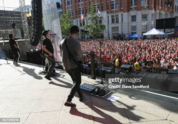 Patrick Stump, Joe Trohman, Andy Hurley and Pete Wentz of Fall Out Boy perform in the pregame concert on the steps of the Smithsonians National...