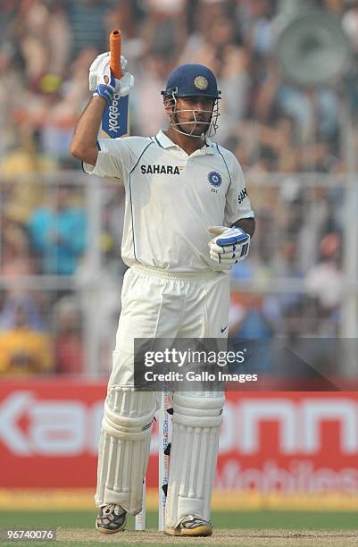 Mahendra Singh Dhoni of India celebrates his 100 during the day three of the Second Test match between India and South Africa at Eden Gardens on...