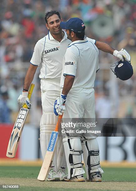 Laxman of India celebrates his 100 with Mahendra Singh Dhoni during the day three of the Second Test match between India and South Africa at Eden...