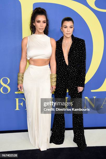 Kim Kardashian West and Kourtney Kardashian attend the 2018 CFDA Fashion Awards at Brooklyn Museum on June 4, 2018 in New York City.
