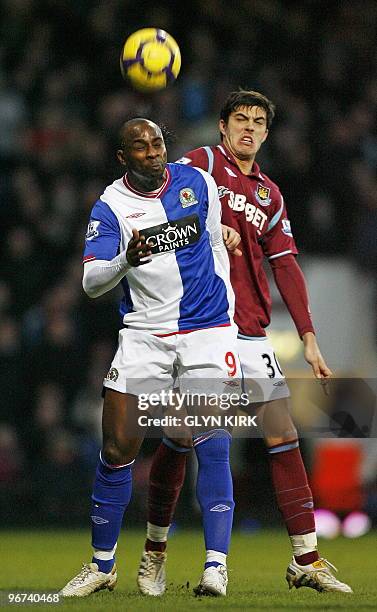 West Ham's English defender James Tomkins vies with Blackburn's English-Grenadian striker Jason Roberts during the English Premier League football...