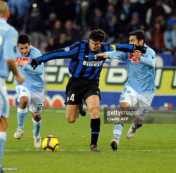 Inter Milan's captain Xavier Zanetti fights for the ball with SSC Napoli's Michele Pazienza during their Serie A football match at San Paolo Stadium...