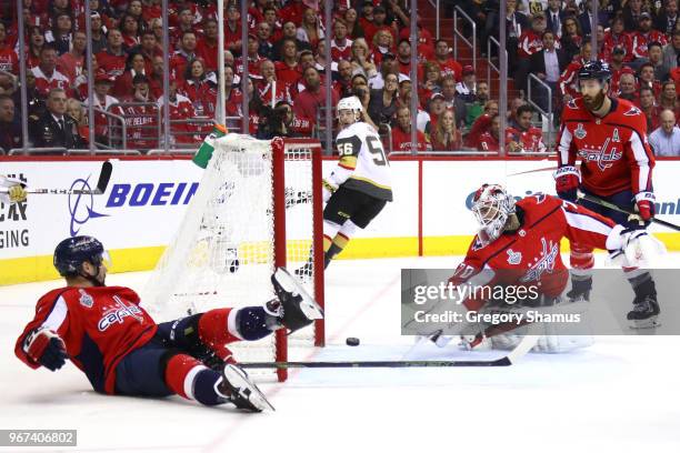 Braden Holtby of the Washington Capitals grabs the puck after it hit the post against the Vegas Golden Knights during the first period \in Game Four...