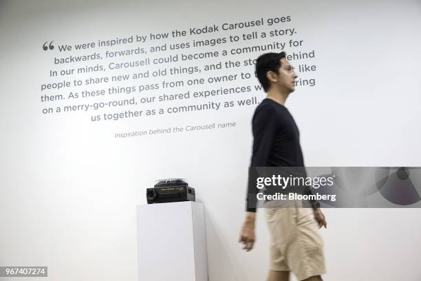 Man walks past a quote displayed on a wall at the Carousell Pte headquarters in Singapore, on Thursday, May 24, 2018. Six-year-old Carousell operates...