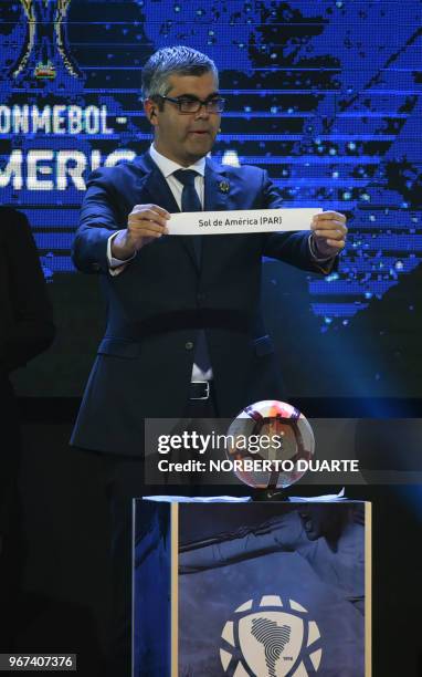 Conmebol Competitions' director Frederico Nantes, shows the name of Paraguayan team Sol de America, during the draw of the Copa Sudamericana second...