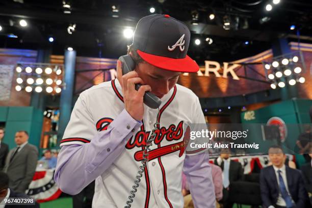 Carter Stewart who selected eighth overall in the 2018 MLB Draft by the Atlanta Braves talks to the Braves front office during the 2018 Major League...