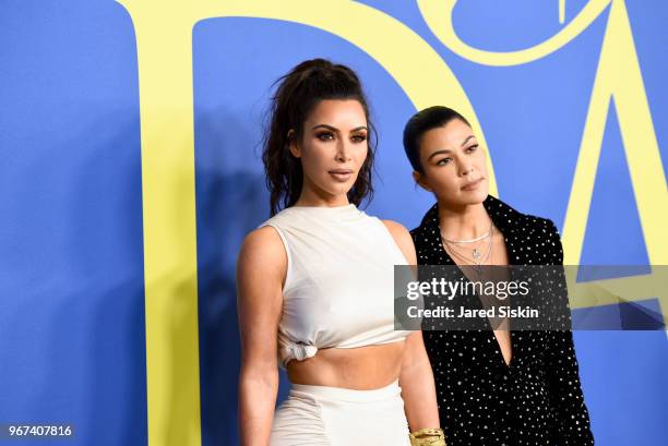 Kim Kardashian West and Kourtney Kardashian attend the 2018 CFDA Fashion Awards at Brooklyn Museum on June 4, 2018 in New York City.