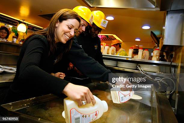 Gail Davis from Sky Sports News together with Joe Simpson and and Paul Sackey of London Wasps prepare pancakes during a photo call to promote the...