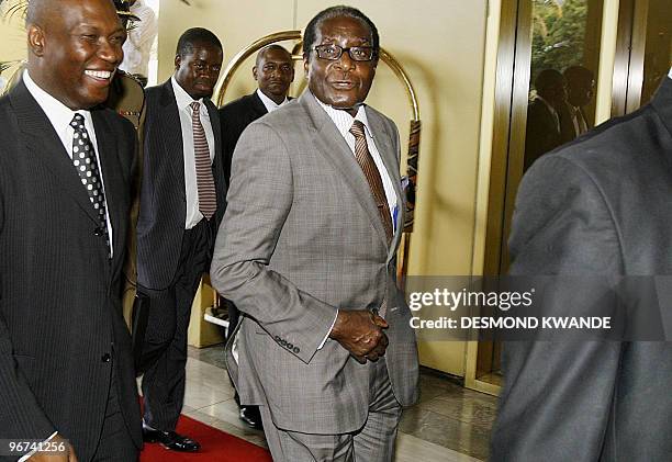 Zimbabwe President Robert Mugabe arrives at a Harare hotel on October 14, 2008 for talks with former South African leader Thabo Mbeki on a faltering...