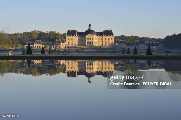 The chateau as seen in the square reflecing pool on October 15, 2012 in Vaux le Vicomte, France.