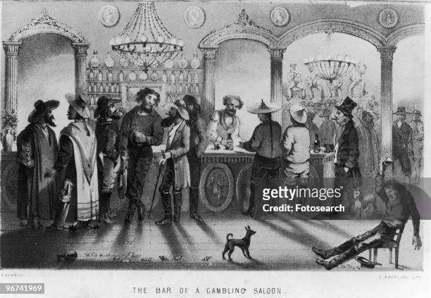 Illustration depicting 'The Bar of a Gambling Saloon,' with men standing at the bar, and a drunk slumped in a chair. USA, date unknown.