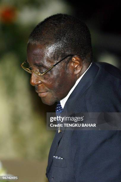 Zimbabwe President Robert Mugabe leaves his seat after attending a dinner banquet during the 2007 Langkawi International Dialogue opening ceremony in...