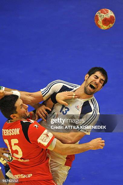 France's Nikola Karabatic reacts as he is fouled by Iceland's Alexander Petersson on January 30 during the EHF EURO 2010 Handball Championship...