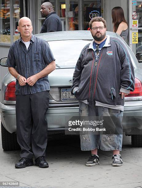 Actor Bruce Willis and director Kevin Smith on location for "A Couple of Dicks" on the Streets of Brooklyn on July 24, 2009 in New York City.