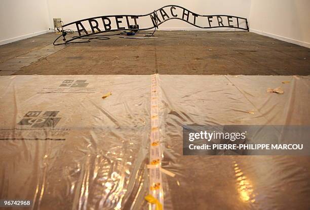 An art piece representing the slogan "Arbeit macht frei" placed at the gate of former Nazi German death camp of Auschwitz-Birkenau is pictured at the...