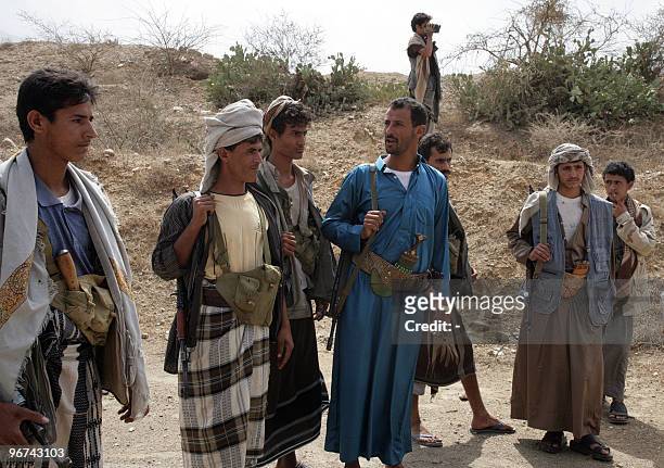 Yemeni Shiite Huthi rebels supervise the re-opening of a road in Saada, north of Sanaa, on February 16, 2010 following a truce between the rebels and...