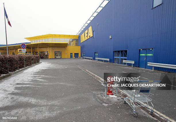 An empty cart sits outside the Ikea store in Roissy-en-France, north of Paris, as workers of the Swedish furniture designer Ikea hold a national...