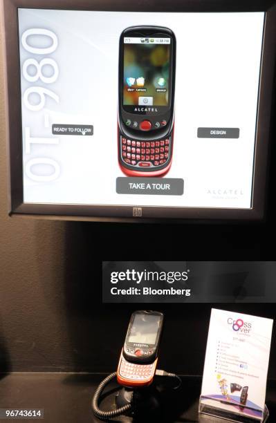 The Alcatel OT-980 handset sits on display at the Mobile World Congress in Barcelona, Spain, on Tuesday, Feb. 16, 2010. Leading mobile executives...