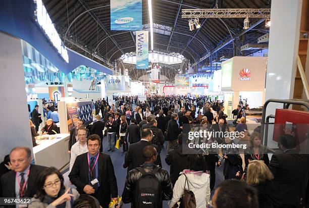 Visitors walk through the Mobile World Congress venue in Barcelona, Spain, on Tuesday, Feb. 16, 2010. Leading mobile executives from across the globe...