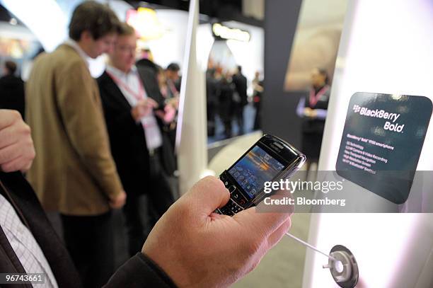 Visitor tests the Blackberry Bold at the Mobile World Congress in Barcelona, Spain, on Tuesday, Feb. 16, 2010. Leading mobile executives from across...