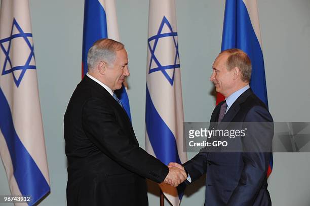 In this handout photo provided by the Israeli Government Press Office , Israeli Prime Minister Benjamin Netanyahu meets with Russian Prime Minister...