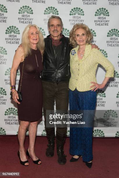 From left to right, a guest, Jeremy Irons, and Tina Santi Flaherty attend Irish Repertory Theatre 2018 Gala Benefit at The Town Hall on June 4, 2018...