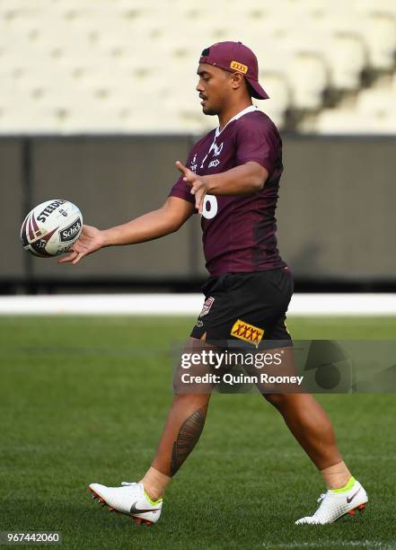 Anthony Milford of the Maroons kicks the ball during a Queensland Maroons Captain's Run at the Melbourne Cricket Ground on June 5, 2018 in Melbourne,...