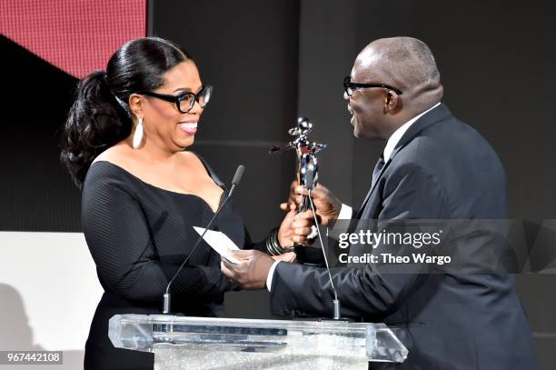 Oprah Winfrey presents Edward Enninful with the 2018 CFDA Media Award during the 2018 CFDA Fashion Awards at Brooklyn Museum on June 4, 2018 in New...